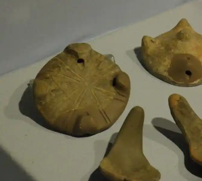 Pre-Christian cross on Bronze Age clay disc, closely resembling a solar cross, located at Archaeological Museum of Izmir, Turkey
